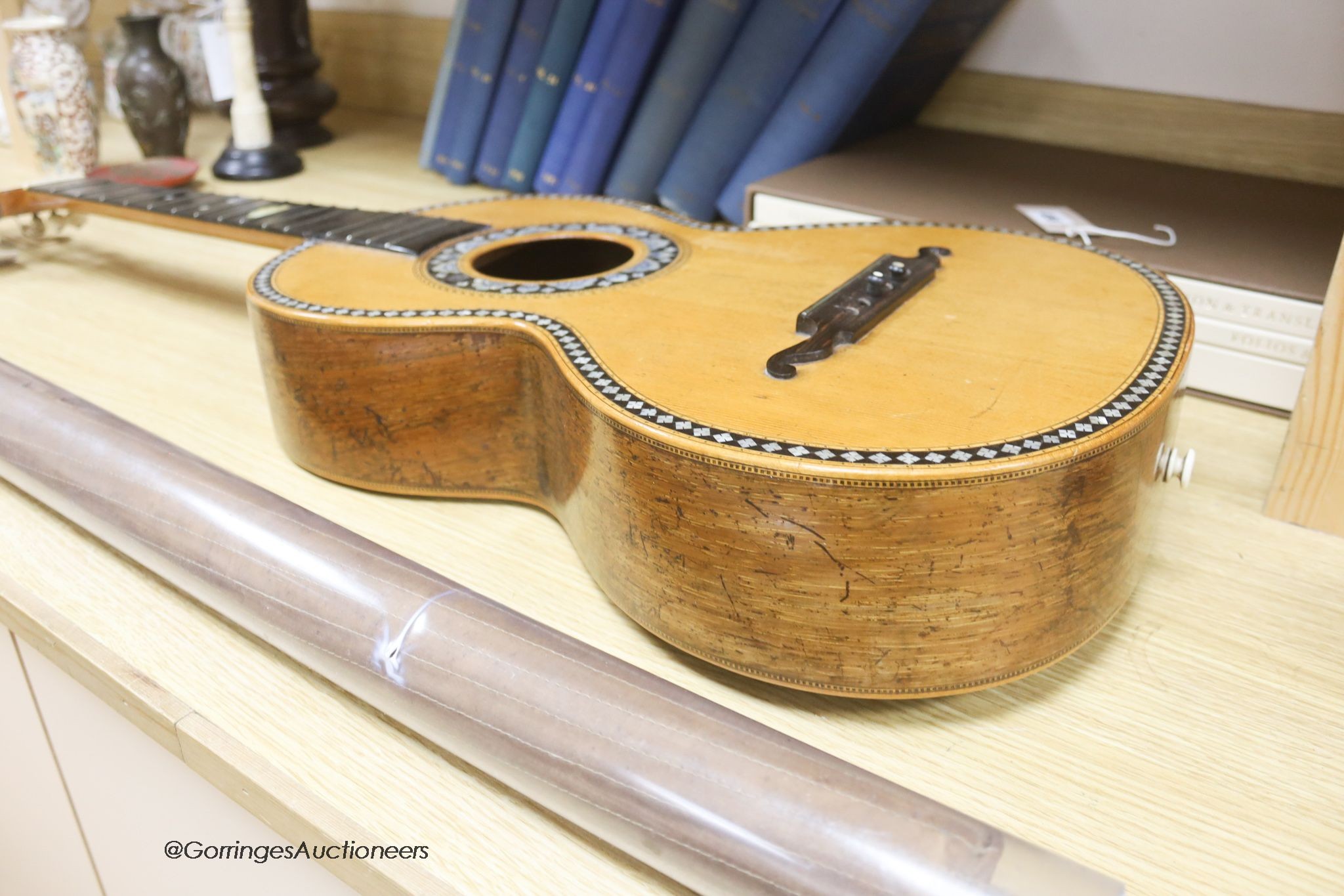 A Mexican mother of pearl inlaid acoustic guitar (no strings)